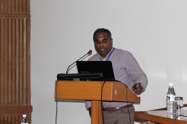 10. Dr. Denny John giving presentation on healthcare